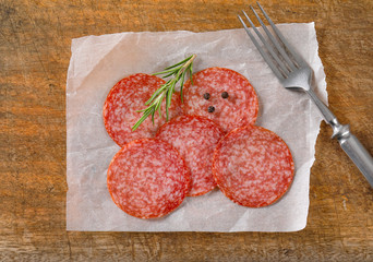 Canvas Print - Thinly sliced salami sausage