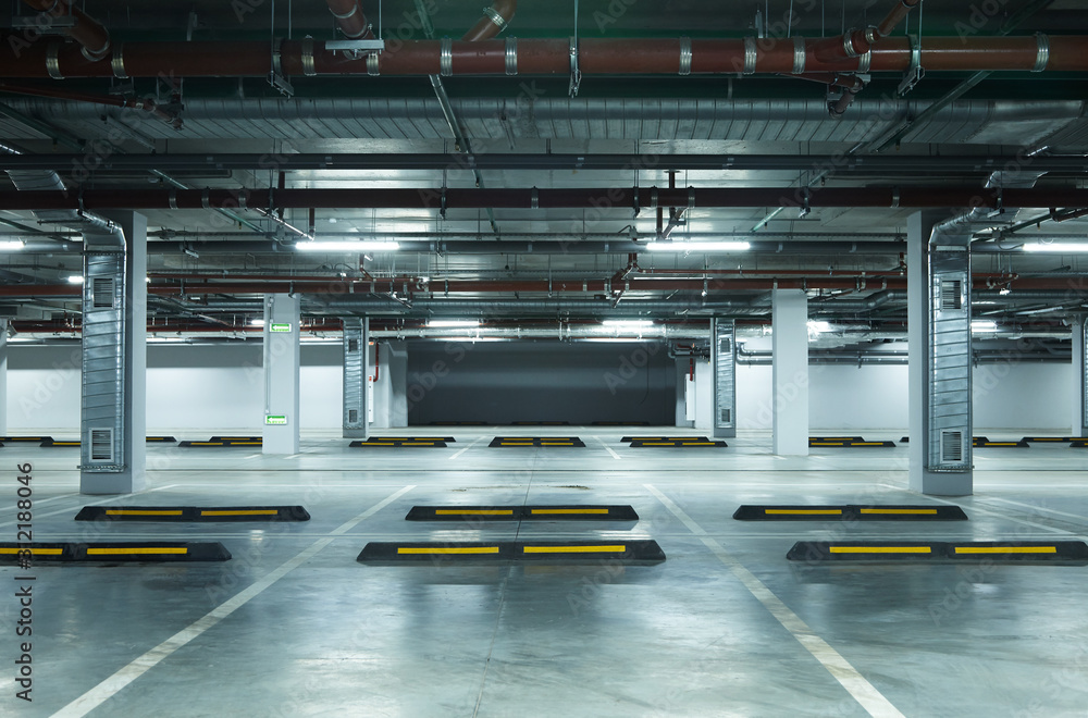 Horizontal image of empty underground parking lot - obrazy, fototapety, plakaty 