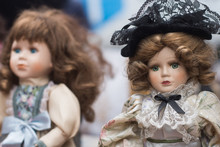 Closeup Of Vintage Dolls At Flea Market In The Street