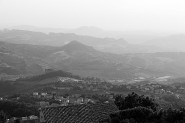 Old town of San Marino with the hilly landscape in the background