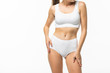 © F8  \ Suport Ukraine - Partial side view of slim woman in underwear isolated on white background