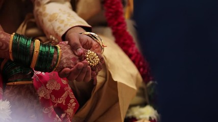 Poster - Traditional indian wedding ceremony, groom holding hand in bride hand