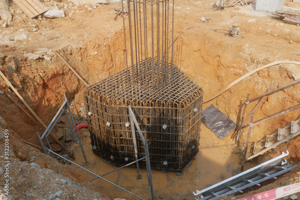 Pile cap and column stump under construction at the construction site ...
