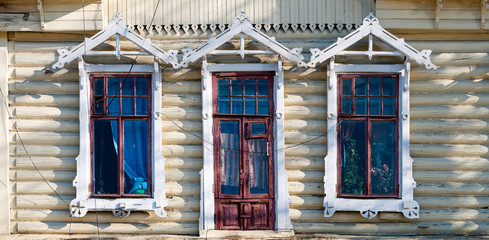 Wall Mural - Dark old wood log wall of house