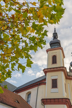 Litomysl, Czech Republic, Tower Od Church Of The Discovery Of The Holy Cross With Leaves In Autumn, Church Is In Baroque Style. In Czech Language: Kostel Nalezeni Svateho Krize.