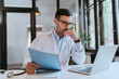 © bnenin - Portrait of a pensive doctor working in the office.