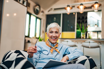 Poster - Portrait of a happy senior woman at home.