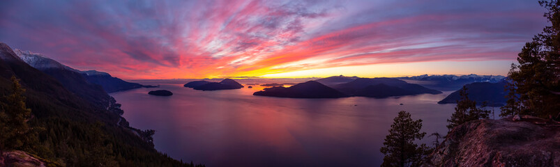 Wall Mural - Tunnel Bluffs Hike, in Howe Sound, North of Vancouver, British Columbia, Canada. Panoramic Canadian Mountain Landscape View from the Peak during sunny winter sunset.