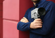 © New Africa - Man with vintage video camera outdoors, closeup