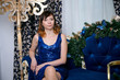 © Nikolay - Young ordinary woman. Young female in blue cocktail dress.