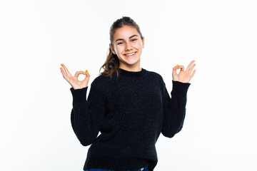 Happy teenage girl showing ok sign isolated on white background