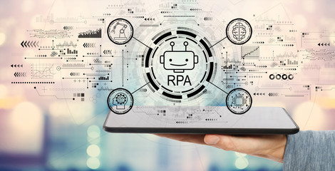 Robotic process automation concept with man holding a tablet computer