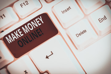 Text sign showing Make Money Online. Business photo showcasing making profit using internet like freelancing or marketing White pc keyboard with empty note paper above white background key copy space