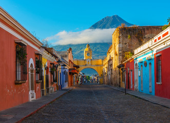cityscape of the main street and yellow santa catalina arch in the historic city center of antigua a