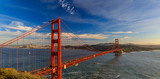 Fototapeta Mosty linowy / wiszący - Panorama of the Golden Gate bridge with the Marin Headlands and San Francisco skyline at colorful sunset, California