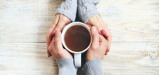 Wall Mural - Cup drink for Breakfast in the hands of lovers. Selective focus.