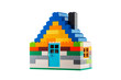 © ValentinValkov - House made of classic building blocks, white studio background.
