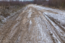 The Bad Ground Or Soil Rural Or Suburb Winter Road Or Way With Ice, Snow, Puddles, Pools, Mud And Slush