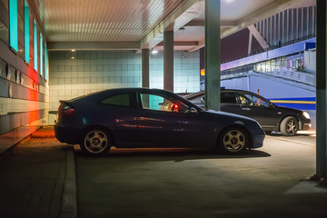 Wall Mural - cars at night in a parking lot