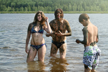 Dad, Daughter And Son Wash Away The Healing Mud In The Lake. Russian Family On Treatment