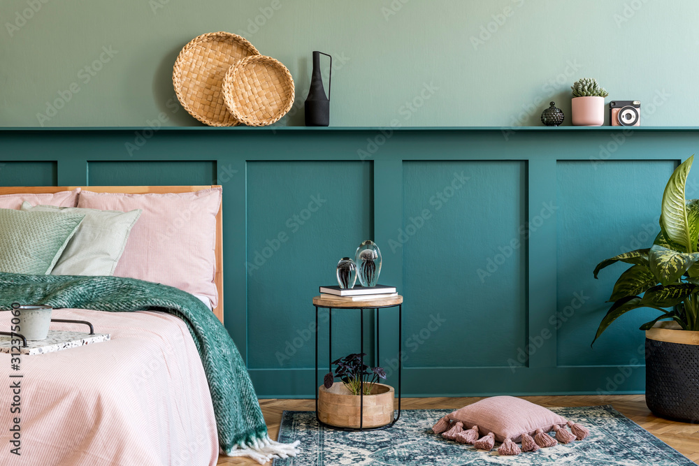 Stylish composition of bedroom interior with wooden bed, design furnitures, shelf, flowers in vase and elegant personal accessories. Beautiful bed sheets, blanket and pillow. Template. Home staging.  - obrazy, fototapety, plakaty 