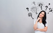 © Tierney - Question marks with young woman in a thoughtful face