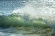 © Lori Labrecque - Sunlight shining through waves crashing on a beach, turning them colors of green and gold. Image taken at Papohaku Beach, in Molokai, Hawaii.