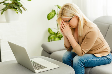 Wall Mural - young woman with laptop works at home