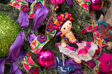 Wall Mural -  Christmas tree with traditional Mexican decorations, rag dolls, traditional colored ribbons of Mexican culture