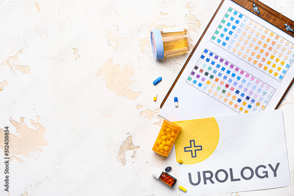 Paper sheet with text UROLOGY, pills and urine sample on light background