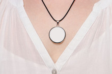 Round Pendant With Black Cord, On The Neck Of A Woman, Product Mock Up