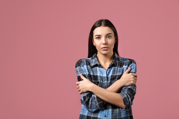 Sticker - Portrait of worried young woman on color background