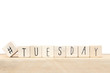 © annebel146 - Wooden cubes with a hashtag and the word Tuesday, social media concept near white background