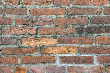 Sticker - Weathered old red brick background with rough surface.