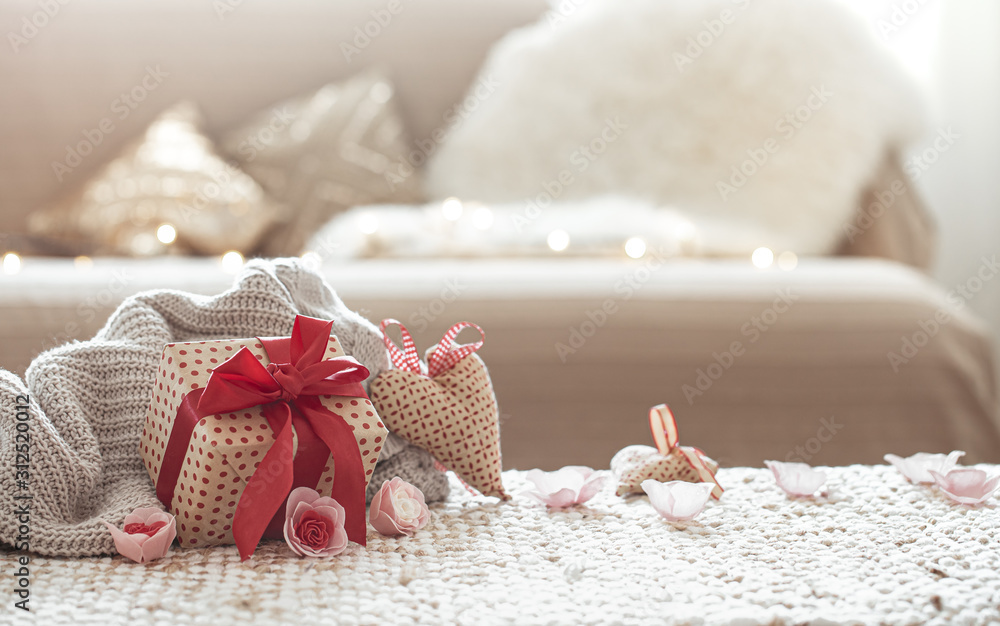 The concept of Valentine's day. Gift box on the table. - obrazy, fototapety, plakaty 