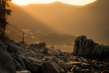 Wall Mural - sunrise over the mountains near sea