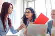 © MDBPIXS - Creative businesswomen discussing in meeting at office