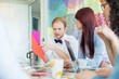 © MDBPIXS - Businessman explaining documents to female colleagues in creative office