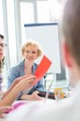 © MDBPIXS - Creative businesswoman in meeting with colleagues at office