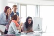 © MDBPIXS - Smiling businesspeople working together at conference table