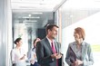 © MDBPIXS - Business people walking in corridor