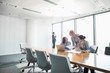 © MDBPIXS - Businesswomen looking at documents in conference meeting