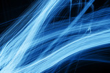 Fototapeta Dmuchawce - Colorful pattern of blue dynamic neon lines. Modern background. Trendy shade of blue
