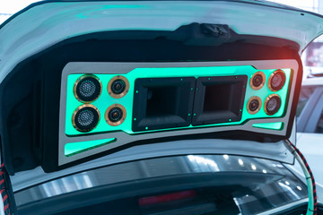 Wall Mural - colorful lights of stereo and speakers in car