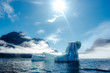 © Chris Zielecki/Stocksy - Glowing blue icebergs in sunlight
