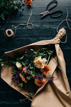 Fresh Flowers Bouquet With Vintage Scissors On Dark Table
