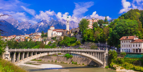 travel in northern italy - beautiful belluno town surrounded by impressive dolomite mountains