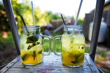 Icy refreshment tropical cocktails. Exotic tasty alcohol drinks for the heats in the summer. Lime, ice, mint and lemonade.