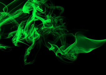 Green smoke abstract on black background. darkness concept