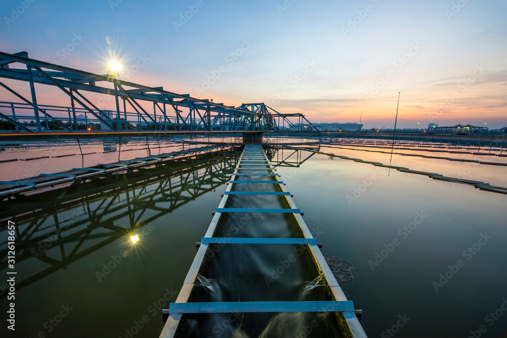Water treatment plant with sunset. water treatment plant, ecosystem, waste water, water recycle, water purification or environment industry concept - obrazy, fototapety, plakaty 